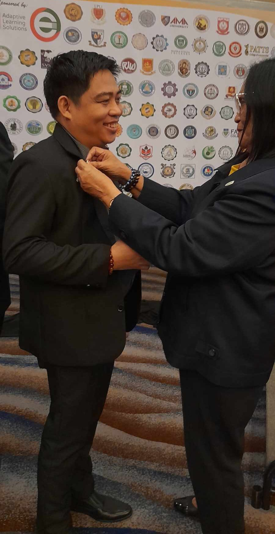 Dr. De Leon re-investitured, inducted as PACUCOA accreditor
